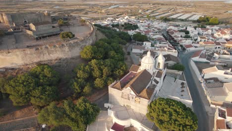 Pan-right-aerial-shot-around-historical-Church-of-Our-Lady-of-Martyrs-in-Castro-Marim,-Algarve