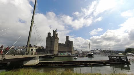 Timelapse-historic-Caernarfon-castle-swinging-river-bridge-tourist-town-landmark