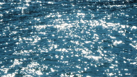 Slow-motion-of-beautiful-sea-water-surface-with-sparks