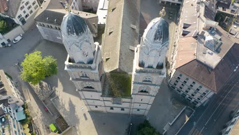 Close-Up-Aerial-Shot-of-Famous-Grossmünster-Cathedral-in-Zurich,-Switzerland