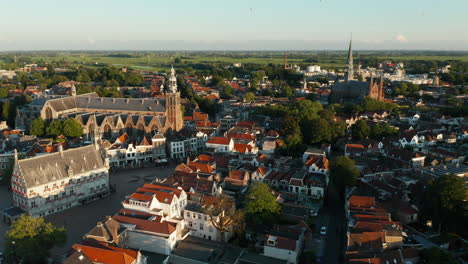 Panorama-Of-The-Old-Town-Hall-And-The-Historical-Churches-In-Gouda-City,-South-Holland