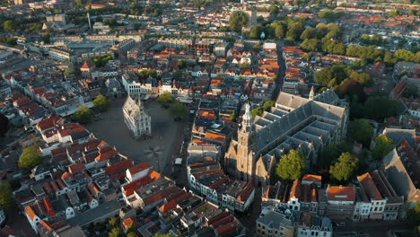 Aerial-View-Of-Saint-John-Church-Adjacent-To-Gouda's-15th-Century-Town-Hall-And-Gouda-City-In-Netherlands