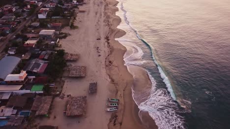 Aerial-birds-eye-view-of-calm-seaside-near-Acapulco-village-in-Mexico-at-dusk