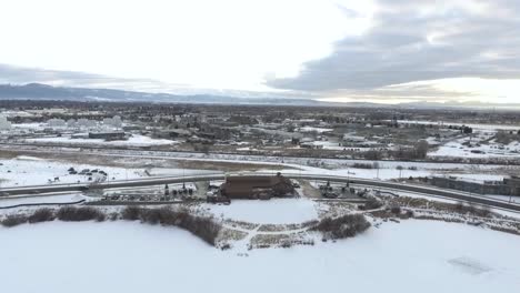 AERIAL---Building-sits-in-snow-covered-Montana
