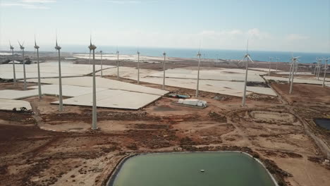 fantastic-drone-orbit-shot-of-wind-turbines-in-a-wind-farm-on-the-island-of-Gran-Canaria,-Canary-Islands
