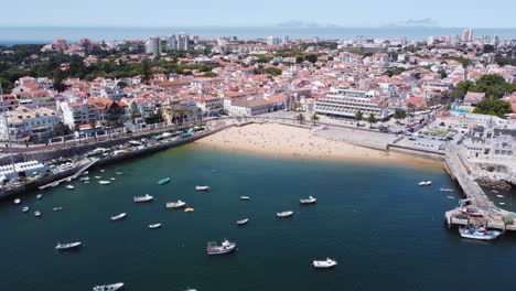 AERIAL-Flying-Away-Shot-from-Cascais-Bay-Area,-Portugal