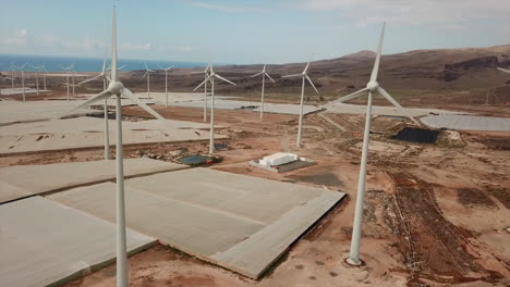 shot-of-drone-moving-away-from-wind-turbines-in-a-wind-farm-on-the-island-of-Gran-Canaria,-Canary-Islands