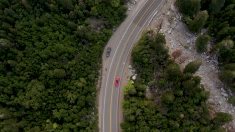 Aerial-View-Of-Red-Convertible-1958-Chevrolet-Impala-Driving-Big-Cottonwood-Canyon-Scenic-Drive-In-Utah,-USA