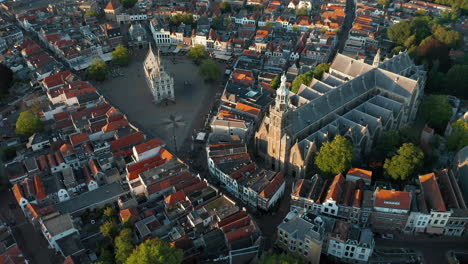 Bird's-Eye-View-Of-Saint-John-Church-Beside-The-Market-Square-In-The-Cityscape-Of-Gouda,-Netherlands