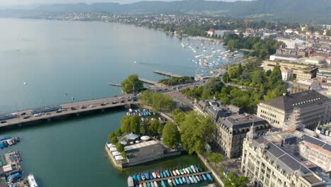 Aerial-Pan-Up-Reveals-Lake-Zurich-in-Downtown-Zurich,-Switzerland-on-Beautiful-Summer-Day