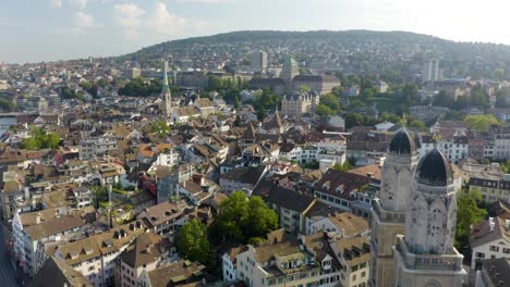 Incredible-Establishing-Shot-Above-Grossmunster-Cathedral-and-Zurich-Old-Town