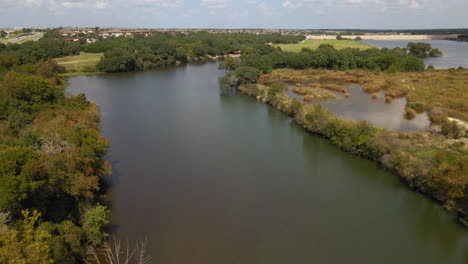 Aerial-view-of-luxurious-Central-Texas-river-and-surrounding-nature-trails,-drone-4K