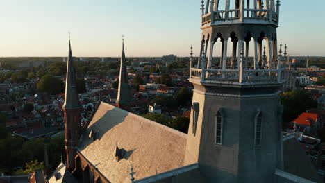 Aerial-View-Of-The-Neo-Gothic-Exterior-Of-The-Church-Spire-Of-Gouwekerk-In-Gouda,-South-Holland
