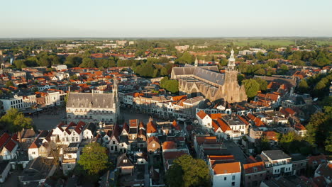 Panoramic-View-Of-The-Saint-John-Church-And-Old-Town-Hall-Amidst-The-Cityscape-Of-Gouda
