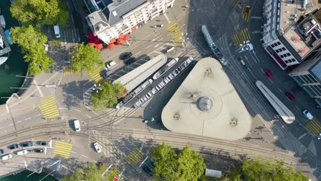 Top-Down-Aerial-View-of-Buses,-Cars-at-Busy-European-Intersection