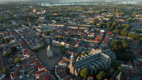 Panorama-Of-Sint-Janskerk-Church-And-Old-Town-Hall-Within-The-City-Landscape-Of-Gouda,-South-Holland