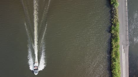 Aerial-view-of-motor-boat-sailing-into-the-harbor