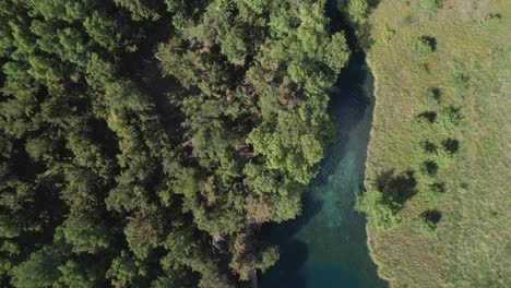 Aerial-view-of-a-river-and-people-swimming