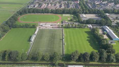 Aerial-of-rugby,-field-track-and-football-fields