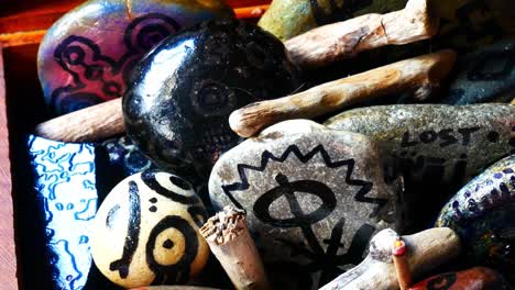 Mysterious-Viking-drawing-painted-spiritual-stones-colourful-hobby-art-collection-in-wooden-box-with-burning-incense