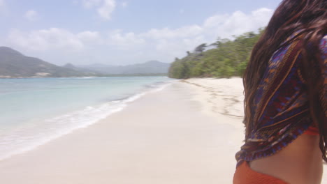 Smiling-Happy-Carefree-Latino-Lady-Flirting-Looking-at-Camera-on-Tropical-Beach,-Playa-Teco-Maimon,-Dominican-Republic,-Handheld-Shot