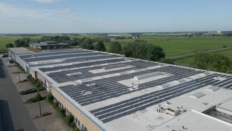 Jib-down-of-industrial-building-filled-with-solar-panels