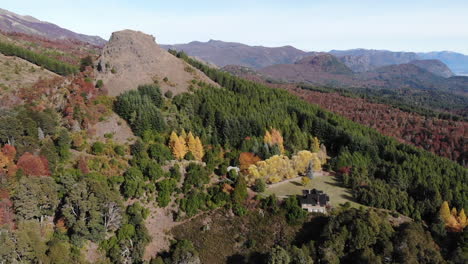 Aerial-view-showing-idyllic-greened-mountain-landscape-during-sunny-autumn-day---Bariloche,Patagonia