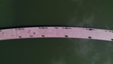 Dronie-of-a-footbridge-in-a-lake