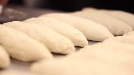 Chef-hands-preparing-dough-for-bread,-pasta-or-pizza