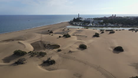 Flight-over-of-Maspalomas-sand-dunes-and-resort,-Gran-Canaria,-Canary-islands,-Spain