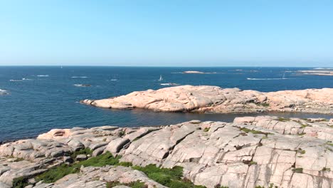 Calm-Blue-Sea-With-Huge-Granite-Rocks-On-A-Sunny-Day