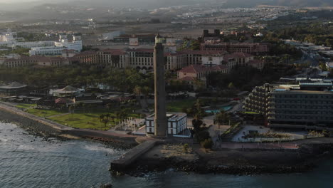 Aerial-lighthouse-view-in-Meloneras-district-on-Gran-Canaria-island,-Maspalomas-in-Spain