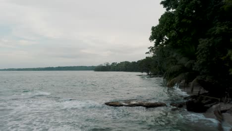 Calm-Waves-In-Caribbean-Coast-In-The-Island-Of-Punta-Mona-In-Costa-Rica-On-A-Cloudy-Day