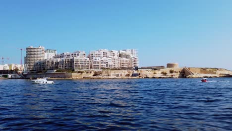 Malta,-modern-Sliema-and-Tigne-area-from-the-sea-view-at-sunny-summer-day