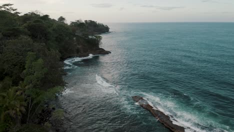 Turquoise-Blue-Waves-Crashing-On-Rocky-Outcrops-Near-The-Island-Of-Punta-Mona,-Caribbean-Coast-Of-Costa-Rica