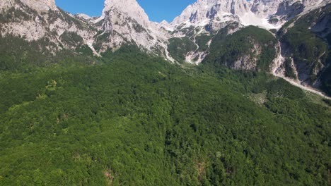 Wild-forest-and-beautiful-mountain-with-high-peaks-covered-in-snow,-Valley-of-Valbone-in-Albania