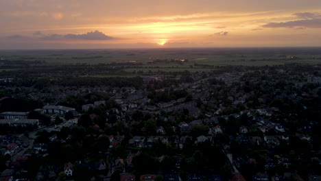 Aerial-overview-of-a-small,-suburban-town-at-sunrise