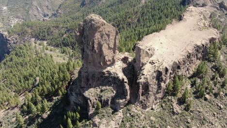 Aerial-view-of-Roque-Nublo-which-is-a-volcanic-rock-on-the-island-of-Gran-Canaria,-Canary-Islands,-Spain