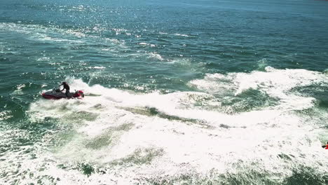 Close-up-of-a-jet-ski-doing-stunts-in-open-water-during-summer