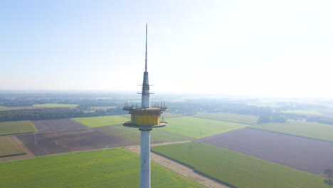 Broadcast-Tower-Plettenberg-On-Countryside-Fields-During-Foggy-Morning-In-Dotternhausen,-Germany