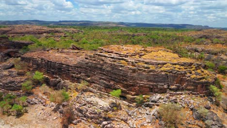 Ancient-Rocky-Outcrop-Of-Ubirr-With-Person-Standing-On-Top---Kakadu-National-Park,-Northern-Territory,-Australia