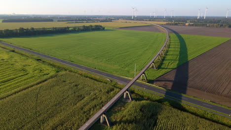 Emsland-Transrapid-Test-Facility-Over-Idyllic-Field-In-The-Town-Of-Lathen-In-Germany---aerial-drone-shot