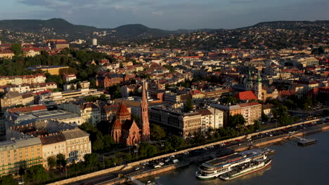 Drone-shot-of-the-Danube-river-and-Budapest-waterfront-in-Hungary