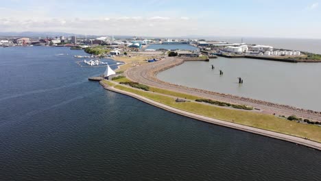Aerial-backwards-shot-of-Cardiff-Bay-and-Docks-on-a-sunny-day