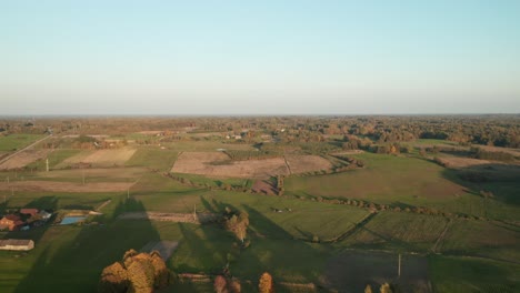AERIAL:-Nature-Landscape-with-Green-Plains-and-Forest-with-Sky-in-Background