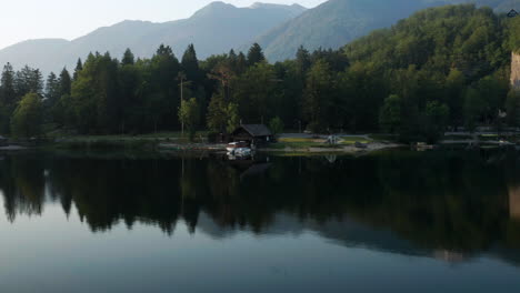 Lush-Green-Forest-At-The-Waterfront-Of-Lake-Bohinj-In-Slovenia-During-Daybreak