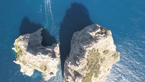 Amazing-overhead-aerial-view-of-Faraglioni-in-summer-season,-Capri---Campania,-Italy