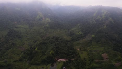 Cinematic-Aerial-view-over-misty-forest-in-Central-American-jungles,-Honduras