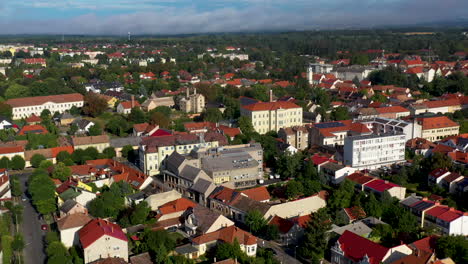 Drone-shot-of-buildings-and-city-streets-of-Keszthely-in-Hungary