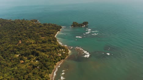 Vibrant-colors-of-beautiful-coastline-with-blue-Caribbean-Sea-in-Costa-Rica---Green-planted-trees-and-golden-beach-during-summer
